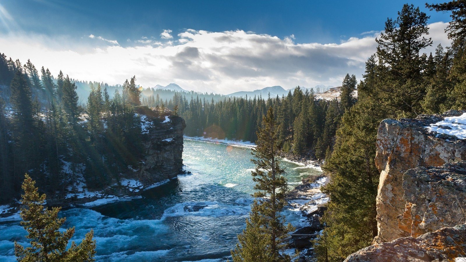 Обои деревья, река боу, горы, bow river, скалы, зима, канада, альберта, горная река, провинция альберта, trees, the bow river, mountains, rocks, winter, canada, albert, mountain river, alberta разрешение 1920x1080 Загрузить